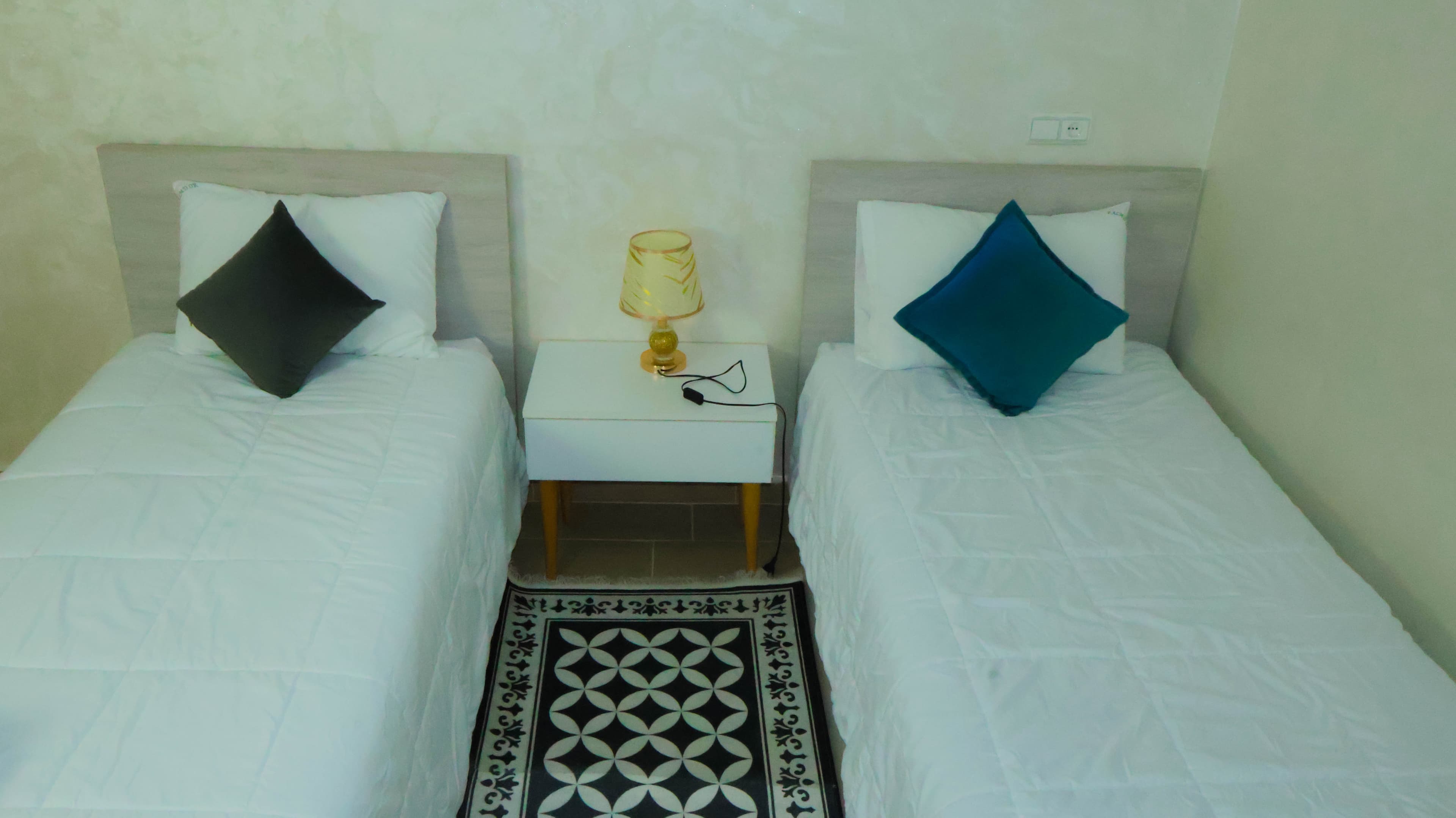 Appartement 2 — deuxième chambre avec deux lits simples