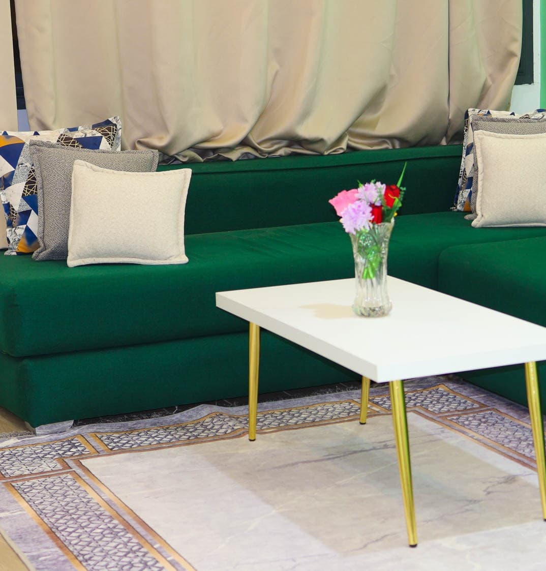 Salon appartement Palm d'Or Dakhla — canapé vert émeraude